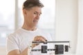 Worried Man Using Weight Scale At Gym Royalty Free Stock Photo