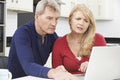 Worried Mature Couple Reviewing Domestic Finances