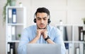 Worried millennial Arab man in headphones making online video call with business partner, having problem at office Royalty Free Stock Photo