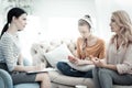 Worried mom and daughter visiting psychologist