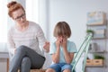 Worried mother comforting crying son