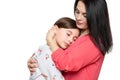 Worried mother embracing and consoling her young daughter. Family relationships concept.