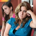 Worried mother and her sad teenage daughter Royalty Free Stock Photo