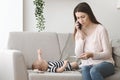 Worried mother calling to doctor asking for advice Royalty Free Stock Photo