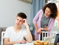 Worried mother scolding teenage son Royalty Free Stock Photo