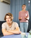 Worried mother talking to upset teenage son at home Royalty Free Stock Photo