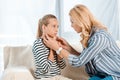 Worried mother touching sick daughter Royalty Free Stock Photo