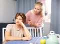 Worried mother talking to upset teenage son at home Royalty Free Stock Photo