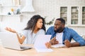 Worried multiracial couple with laptop Royalty Free Stock Photo