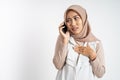 worried muslim woman in hijab making a call using a cell phone Royalty Free Stock Photo