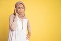 worried muslim woman in hijab making a call using a cell phone Royalty Free Stock Photo