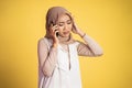 worried muslim woman in hijab making a call using a cell phone Royalty Free Stock Photo