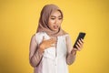 worried muslim woman in hijab using a cell phone Royalty Free Stock Photo