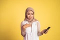 worried muslim woman in hijab using a cell phone Royalty Free Stock Photo