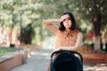 Worried New Mother Walking Baby in Stroller Royalty Free Stock Photo