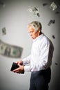 Old man in white and empty wallet. Falling dollars and taxes. Royalty Free Stock Photo