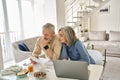 Worried old senior couple checking bank documents or bills at home. Royalty Free Stock Photo