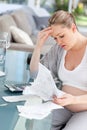 Worried pregnant woman calculating her bills