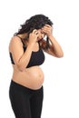 Worried pregnant woman on the phone