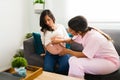 Nurse checking the vital signs of a baby during a home visit Royalty Free Stock Photo