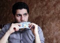 worried sad arab young businessman with dollar bill Royalty Free Stock Photo