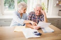 Worried senior couple checking their bills Royalty Free Stock Photo