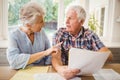 Worried senior couple checking their bills Royalty Free Stock Photo