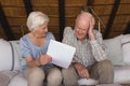 Worried senior couple discussing over medical bills Royalty Free Stock Photo