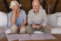 Worried senior couple discussing over medical bills Royalty Free Stock Photo