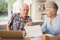 Worried senior couple discussing their bills Royalty Free Stock Photo