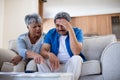 Worried senior couple discussing their bills Royalty Free Stock Photo