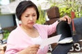 Worried Senior Hispanic Woman Checking Mailbox Royalty Free Stock Photo