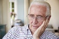 Worried senior man contemplating at home, close up Royalty Free Stock Photo