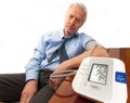 Worried senior man with high blood pressure. Royalty Free Stock Photo