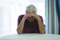 Worried senior man sitting in living room Royalty Free Stock Photo