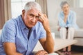 Worried senior man sitting on sofa Royalty Free Stock Photo