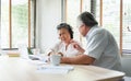 Worried Senior man and woman having problem talk about Financial economic crisis. Stressed Asian Elderly Couple discussing and Royalty Free Stock Photo