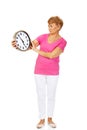 Worried senior woman holding big clock Royalty Free Stock Photo