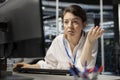 Worried server room employee sees error popup on screen while using software Royalty Free Stock Photo