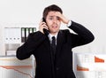 Worried stock broker on the phone Royalty Free Stock Photo