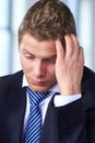 Worried and stressed businessman scratch his head Royalty Free Stock Photo