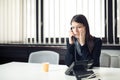 Worried stressed depressed office worker business woman receiving bad news emergency phone call at work.Looking confused