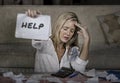 Worried and stressed Caucasian 40s woman holding notepad calculating domestic expenses and taxes payments in budget problem and fi Royalty Free Stock Photo