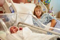 Worried Teenage Girl With Crying Newborn Baby In Hospital Royalty Free Stock Photo