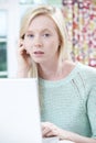 Worried Teenage Girl Using Laptop At Home Royalty Free Stock Photo