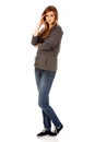 Worried teenage woman with folded arms Royalty Free Stock Photo