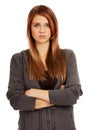 Worried teenage woman with folded arms Royalty Free Stock Photo