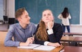 Teenager supporting female classmate