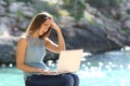 Worried woman checking online information on vacation