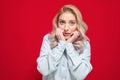 Worried woman. Nervous girl biting her fingernail, isolated on white background